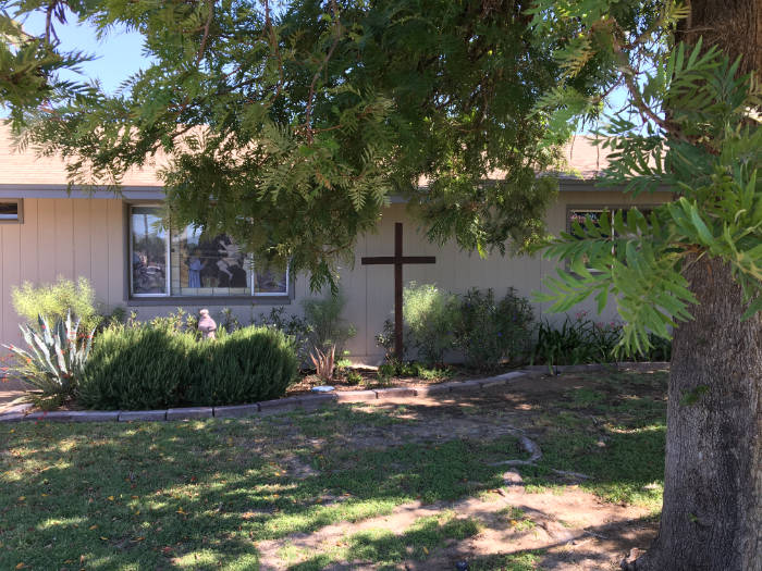 The Church exterior wit a garden cross